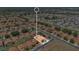 Aerial view of a residential neighborhood showcasing a property with a red tile roof at 119 Hypolita Ave, Davenport, FL 33897