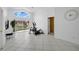 Bright bonus room with exercise equipment, large windows, and tile flooring at 119 Hypolita Ave, Davenport, FL 33897