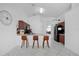 Open kitchen featuring counter seating, modern appliances, and tile flooring at 119 Hypolita Ave, Davenport, FL 33897