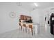 Bright kitchen featuring barstool seating at the counter with tile flooring at 119 Hypolita Ave, Davenport, FL 33897