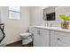 Bathroom with white vanity, faucet, toilet, and a mirror at 121 Edgewater Cir, Sanford, FL 32773