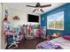 Cozy bedroom with a large window and a TV at 121 Edgewater Cir, Sanford, FL 32773