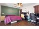 This bedroom features wood floors and is furnished with a desk and a bed at 121 Edgewater Cir, Sanford, FL 32773