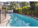 Screened in backyard pool with lush green landscaping at 121 Edgewater Cir, Sanford, FL 32773