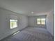 Bright, empty bedroom with neutral carpet and ample natural light at 1243 Bear Oak Ln, Deland, FL 32720