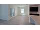 Bright dining room with modern chandelier and view to living area at 1243 Bear Oak Ln, Deland, FL 32720