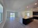 Bright, open-concept living room with tile flooring and sliding glass doors at 1243 Bear Oak Ln, Deland, FL 32720