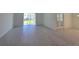 Spacious living room featuring sliding glass doors with outdoor view at 1243 Bear Oak Ln, Deland, FL 32720
