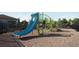 Community playground featuring a blue slide and green climbing structure, perfect for outdoor fun and activity at 1243 Bear Oak Ln, Deland, FL 32720