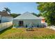 Backyard featuring a patio, a play set, and well-maintained landscaping at 12817 Parkbury Dr, Orlando, FL 32828