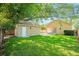 A spacious backyard with a detached garage and an outdoor patio area for entertaining at 1333 W Yale St, Orlando, FL 32804