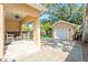Backyard features a covered patio with built-in bar, white chairs, and a detached two-car garage at 1333 W Yale St, Orlando, FL 32804