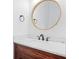 Bathroom featuring a marble countertop, updated fixtures, and a decorative mirror at 1333 W Yale St, Orlando, FL 32804