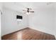 Simple bedroom with wood floors, ceiling fan, neutral decor and window at 1333 W Yale St, Orlando, FL 32804