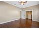 Bedroom featuring hardwood floors, a ceiling fan, closet, and baseboard trim at 1333 W Yale St, Orlando, FL 32804