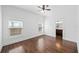 Empty bedroom with hardwood floors, two windows and ceiling fan at 1333 W Yale St, Orlando, FL 32804