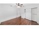 Spacious bedroom featuring hardwood floors, ceiling fan, and a large closet at 1333 W Yale St, Orlando, FL 32804