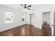 Cozy bedroom with hardwood floors, ceiling fan, large closet, and two windows offering natural light at 1333 W Yale St, Orlando, FL 32804