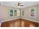Bedroom featuring hardwood floors, bright windows, and neutral paint at 1333 W Yale St, Orlando, FL 32804