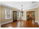 Open dining room featuring hardwood floors, chandelier, and views to other rooms at 1333 W Yale St, Orlando, FL 32804