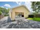 Exterior view of backyard and patio area with a detached two-car garage at 1333 W Yale St, Orlando, FL 32804
