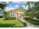 Charming home with landscaped yard, stone walkway, and front porch at 1333 W Yale St, Orlando, FL 32804