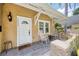 Inviting front porch with white rocking chairs, slate tiles, and cozy decor at 1333 W Yale St, Orlando, FL 32804
