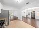 Open kitchen with stainless steel appliances and views into the dining and living areas at 1333 W Yale St, Orlando, FL 32804