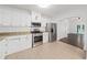 Bright kitchen featuring stainless steel appliances, granite countertops, and ample cabinet space at 1333 W Yale St, Orlando, FL 32804