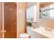 Well-lit bathroom features a white vanity, toilet, and medicine cabinet for ample storage at 1510 Jaguar Cir, Apopka, FL 32712