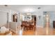 Eat-in kitchen with wood table, wood floors, and a chandelier at 1510 Jaguar Cir, Apopka, FL 32712