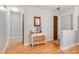 Entryway with wood-look flooring, hall table and fresh neutral paint at 1510 Jaguar Cir, Apopka, FL 32712