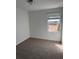 Cozy bedroom with neutral carpet and a window providing natural light at 16464 Happy Eagle Dr, Clermont, FL 34714