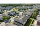 Aerial view of a residential community featuring a pool, playground and mature trees at 2016 Cypress Bay Blvd, Kissimmee, FL 34743