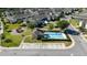 Aerial view of the pool and playground area, parking and the back side of several townhouses at 2016 Cypress Bay Blvd, Kissimmee, FL 34743