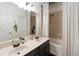 Bathroom with double vanity and a shower/tub combo with a white curtain at 2016 Cypress Bay Blvd, Kissimmee, FL 34743