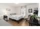 Cozy bedroom featuring wood floors, a comfortable bed, and serene decor at 2016 Cypress Bay Blvd, Kissimmee, FL 34743