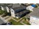Two-story home with a well-kept lawn, brick driveway, and front porch at 2016 Cypress Bay Blvd, Kissimmee, FL 34743