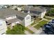 Two-story home with a well-kept lawn, brick driveway, and one-car garage at 2016 Cypress Bay Blvd, Kissimmee, FL 34743