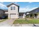 Charming two-story townhome with a well-manicured lawn, a brick driveway, and an attached garage at 2016 Cypress Bay Blvd, Kissimmee, FL 34743