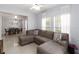 Spacious living area featuring tile flooring, a ceiling fan, and a comfortable sectional sofa at 2016 Cypress Bay Blvd, Kissimmee, FL 34743