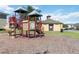 Community playground with a slide, climbing structures, and surrounding green space at 2016 Cypress Bay Blvd, Kissimmee, FL 34743