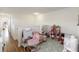 Bright playroom with toys and an adjacent hallway at 2016 Cypress Bay Blvd, Kissimmee, FL 34743