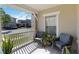 Inviting porch with comfortable seating and plants that offer a relaxing outdoor space at 2016 Cypress Bay Blvd, Kissimmee, FL 34743