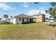 Spacious backyard with a patio area perfect for outdoor entertaining, and ample lawn space at 20335 Macon Pkwy, Orlando, FL 32833