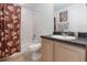 Bathroom features a vanity with a sink and a shower with a curtain at 20335 Macon Pkwy, Orlando, FL 32833