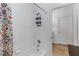 Bright bathroom with shower featuring tiled walls, and neutral-colored flooring at 20335 Macon Pkwy, Orlando, FL 32833