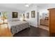 Bedroom features wood floors, natural light, and ensuite bathroom at 20335 Macon Pkwy, Orlando, FL 32833