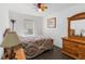 Charming bedroom with a ceiling fan and wood flooring for a cozy atmosphere at 20335 Macon Pkwy, Orlando, FL 32833