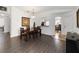 Dining area with wood floors and views into other rooms at 20335 Macon Pkwy, Orlando, FL 32833